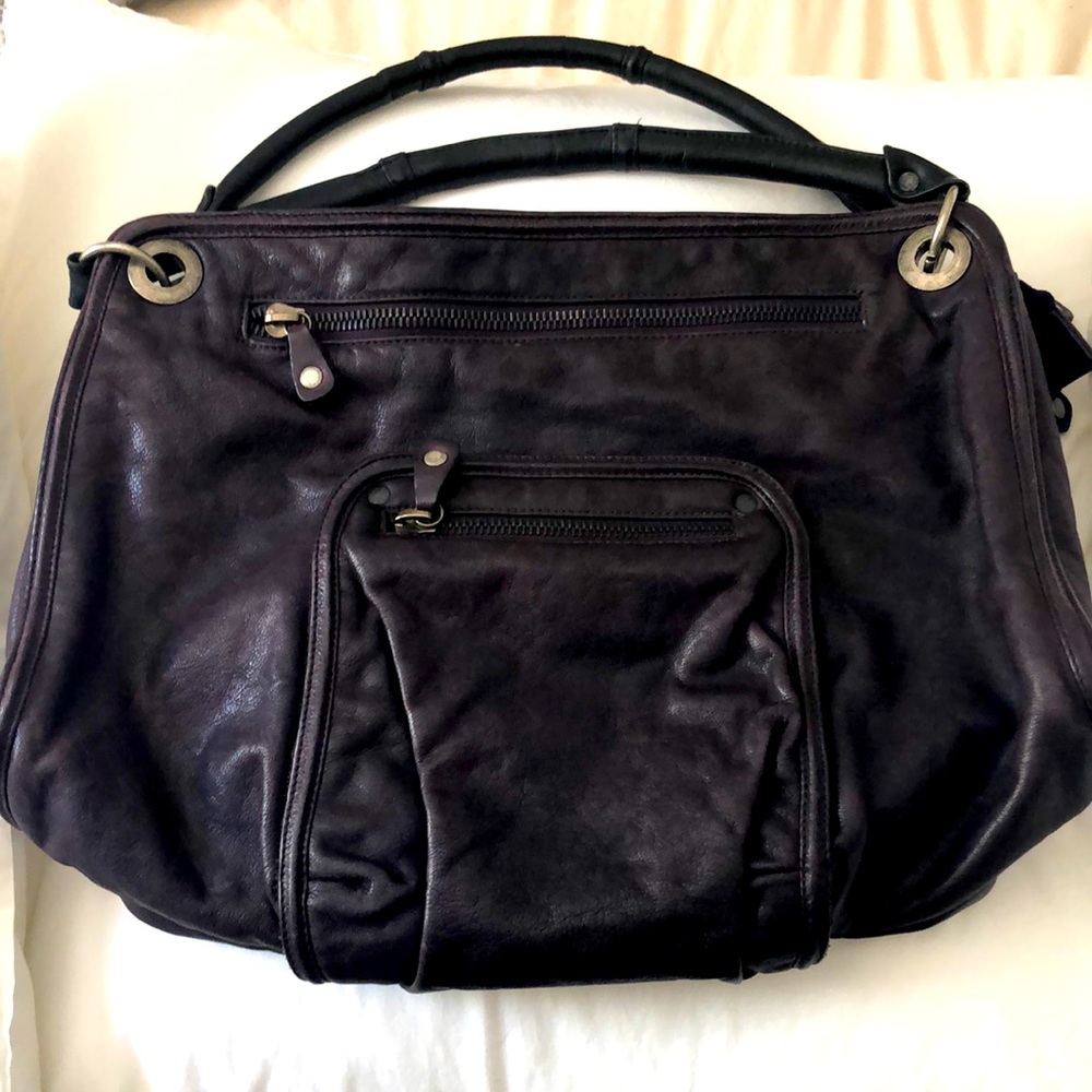 Beautiful leather Andrea Brueckner purse in eggplant color.